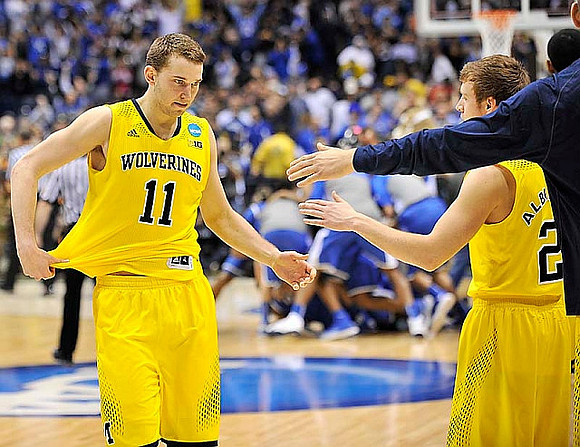 Nik Stauskas (11) and Spike Albrecht (2)