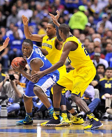 Glenn Robinson III (1) and Caris LeVert (23)