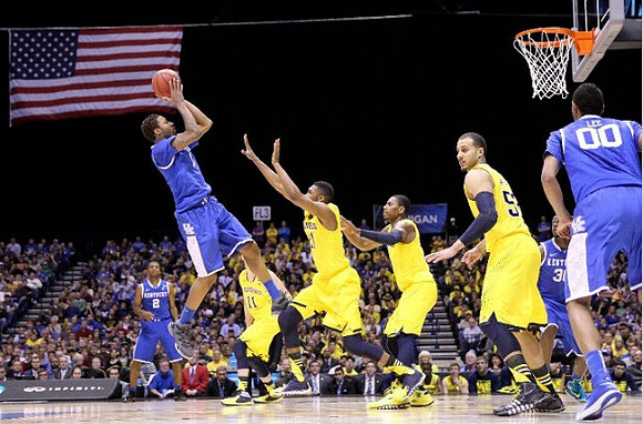Nik Stauskas (11), Zak Irvin (21), Glenn Robinson III (1), and Jordan Morgan (52)