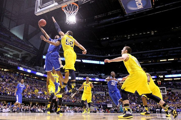 Zak Irvin (21), Jordan Morgan (52), Glenn Robinson III (1), Nik Stauskas (11), and Derrick Walton Jr. (10)