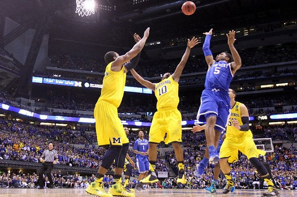 Glenn Robinson III (1), Derrick Walton Jr. (10), and Jordan Morgan (52)
