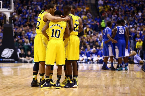 Jordan Morgan (52), Derrick Walton Jr. (10), and Caris LeVert (23)