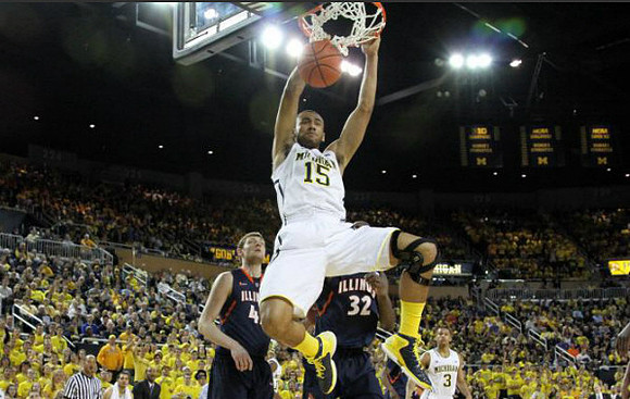 Jon Horford (15) and Trey Burke (3)
