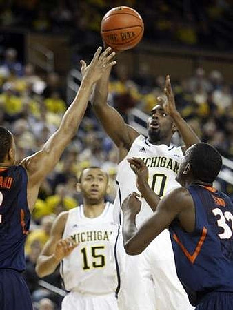Jon Horford (15) and Tim Hardaway Jr. (10)