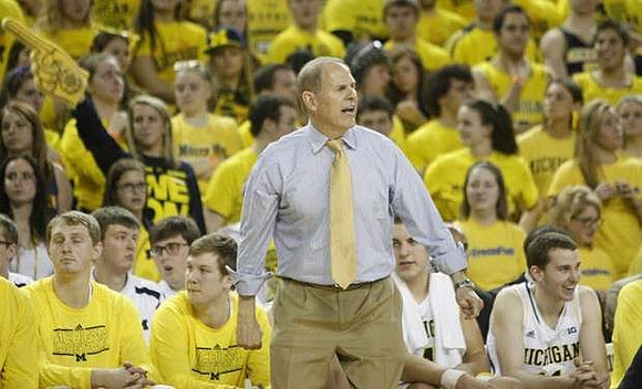 Blake McLimans (22), Matt Vogrich (13), John Beilein, Mitch McGary (4), and Nik Stauskas (11)
