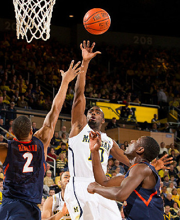 Tim Hardaway Jr. (10) and Jon Horford (15)