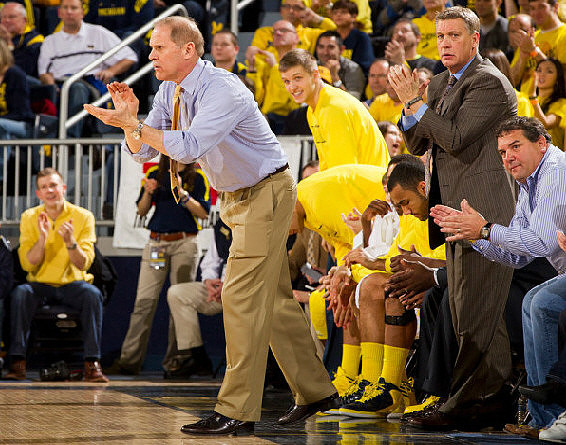 John Beilein, Max Bielfeldt (44), Jon Horford (15), Jeff Meyer, and Brady Hoke