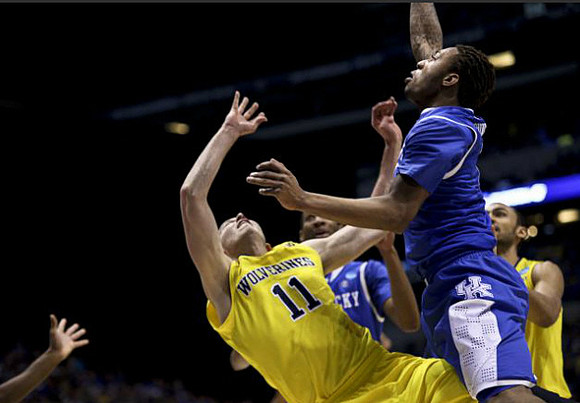 Nik Stauskas (11) and Jon Horford (15)