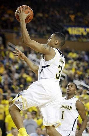 Trey Burke (3) and Glenn Robinson III (1)