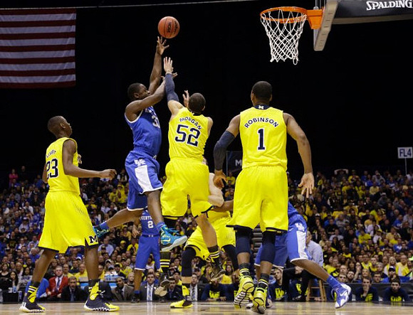 Caris LeVert (23), Jordan Morgan (52), and Glenn Robinson III (1)
