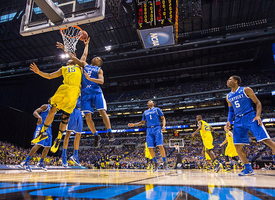Jon Horford (15) and Caris LeVert (23)