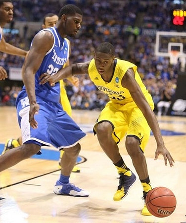 Caris LeVert (23) and Jon Horford (15)