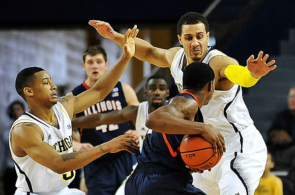 Trey Burke (3) and Jordan Morgan (52)