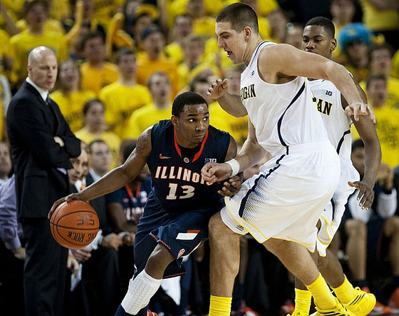 Mitch McGary (4), Glenn Robinson III (1), and Illinois Head Coach John Groce