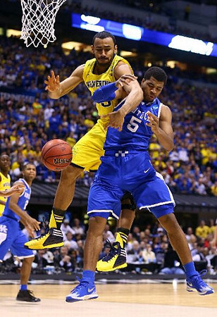 Jon Horford (15) and Caris LeVert (23)