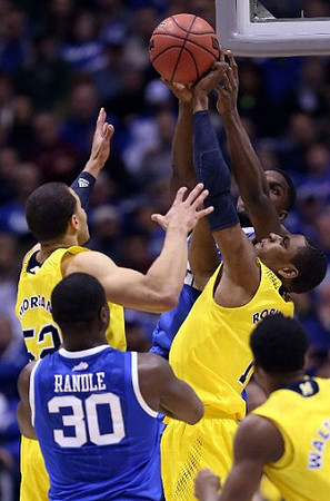 Jordan Morgan (52), Glenn Robinson III (1), and Derrick Walton Jr. (10)
