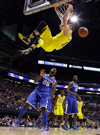 Nik Stauskas (11), Caris LeVert (23), and Glenn Robinson III (1)