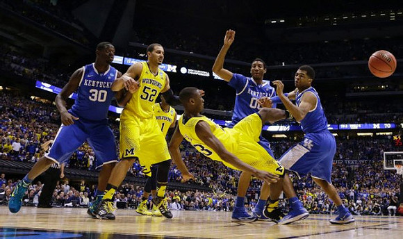 Jordan Morgan (52), Glenn Robinson III (1), and Caris LeVert (23)