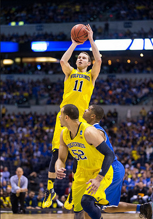 Nik Stauskas (11) and Jordan Morgan (52)