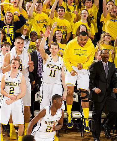 Caris LeVert (23), C.J. Lee, Spike Albrecht (2), Mitch McGary (4), Jon Horford (15), and LaVall Jordan