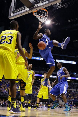 Caris LeVert (23), Derrick Walton Jr. (10), Zak Irvin (21), and Max Bielfeldt (44)