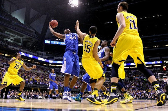 Derrick Walton Jr. (10), Jon Horford (15), and Nik Stauskas (11)