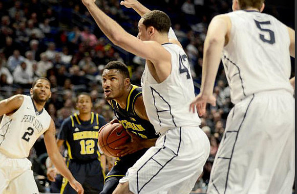 Zak Irvin (21) and Muhammad-Ali Abdur-Rahkman (12)