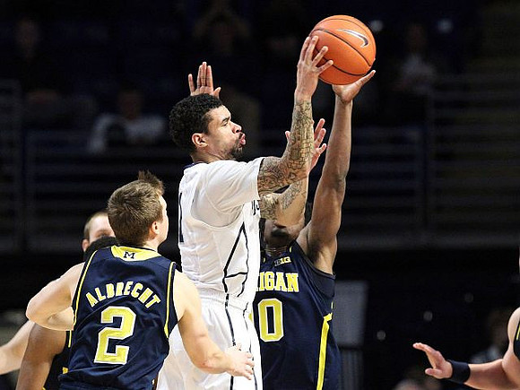 Spike Albrecht (2) and Derrick Walton Jr. (10)