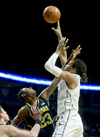 Caris LeVert (23) and Ricky Doyle (32)