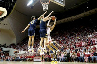 Brandon Johns Jr. (23), Ignas Brazdeikis (13), and Zavier Simpson (3)