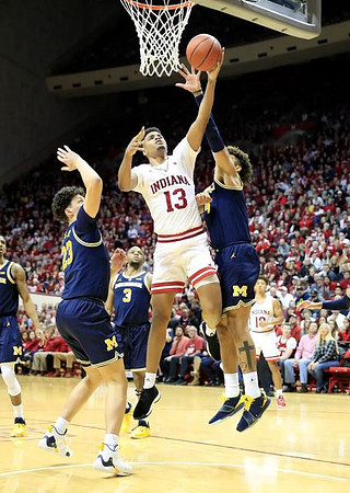 Charles Matthews (1), Brandon Johns Jr. (23), Zavier Simpson (3), and Isaiah Livers (4)