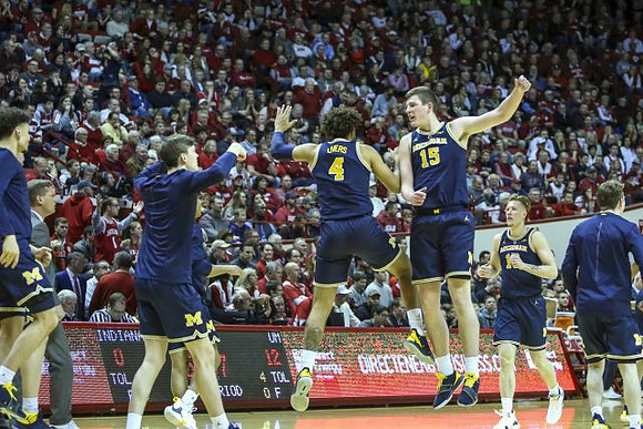 Isaiah Livers (4), Jon Teske (15), and Ignas Brazdeikis (13)
