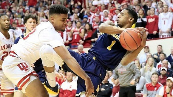 Brandon Johns Jr. (23) and Charles Matthews (1)