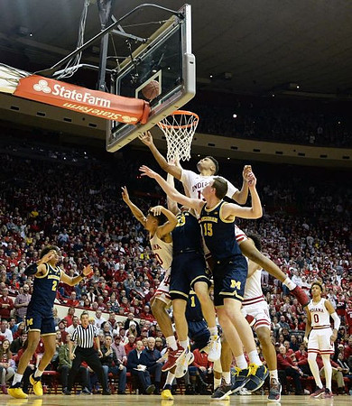 Jordan Poole (2), Ignas Brazdeikis (13), and Jon Teske (15)