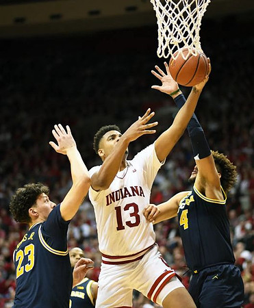 Brandon Johns Jr. (23) and Isaiah Livers (4)
