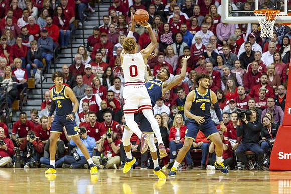 Jordan Poole (2), Charles Matthews (1), and Isaiah Livers (4)