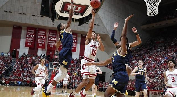 Charles Matthews (1), Zavier Simpson (3), Jordan Poole (2), and Ignas Brazdeikis (13)