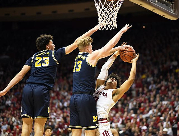 Brandon Johns Jr. (23) and Ignas Brazdeikis (13)