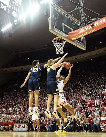 Brandon Johns Jr. (23) and Ignas Brazdeikis (13)