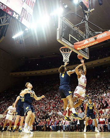 Jon Teske (15), Ignas Brazdeikis (13), Isaiah Livers (4), and Eli Brooks (55)