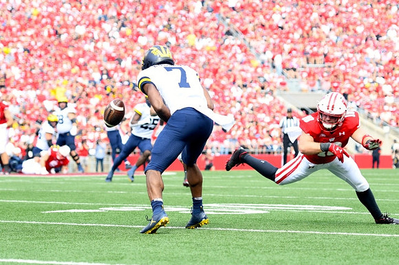 Hassan Haskins (25) and Donovan Edwards (7)