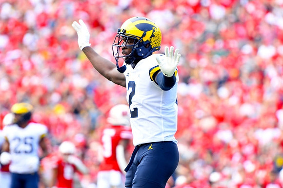 Hassan Haskins (25) and Blake Corum (2)