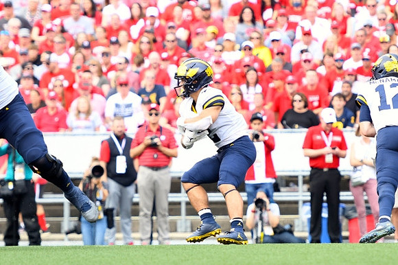 Blake Corum (2) and Cade McNamara (12)