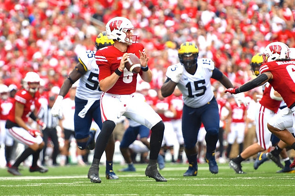 David Ojabo (55) and Christopher Hinton (15)
