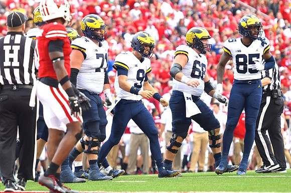 Andrew Stueber (71), J.J. McCarthy (9), Andrew Vastardis (68), and Daylen Baldwin (85)