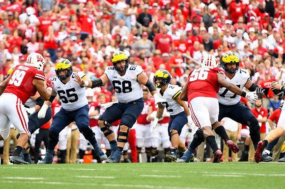 Zak Zinter (65), Andrew Vastardis (68), Blake Corum (2), and Trevor Keegan (77)