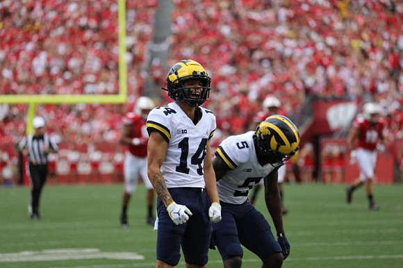Roman Wilson (14) and Mike Sainristil (5)