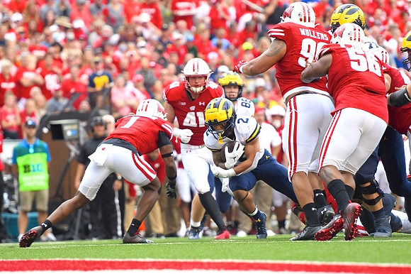 Blake Corum (2) and Luke Schoonmaker (86)