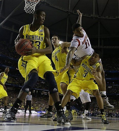 Glenn Robinson III (1), Caris LeVert (23), Mitch McGary (4), and Trey Burke (3)