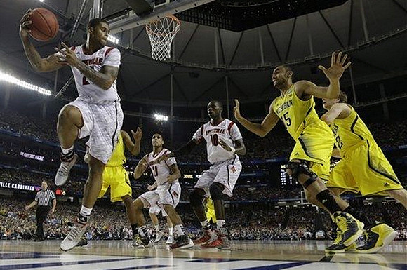 Jon Horford (15) and Spike Albrecht (2)